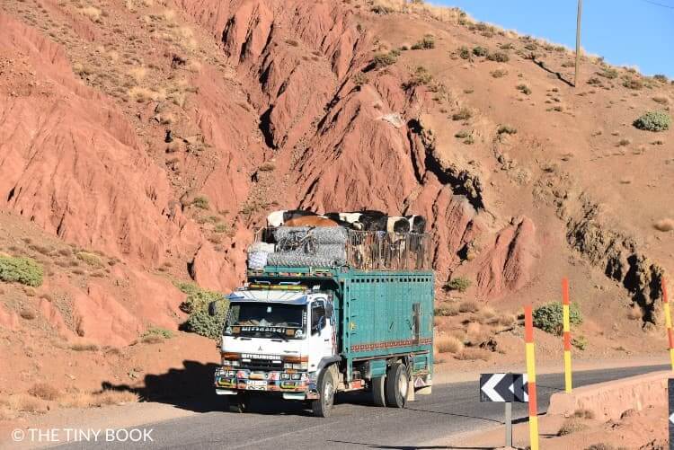 Morocco, truck crossing the Atlas mountain range.