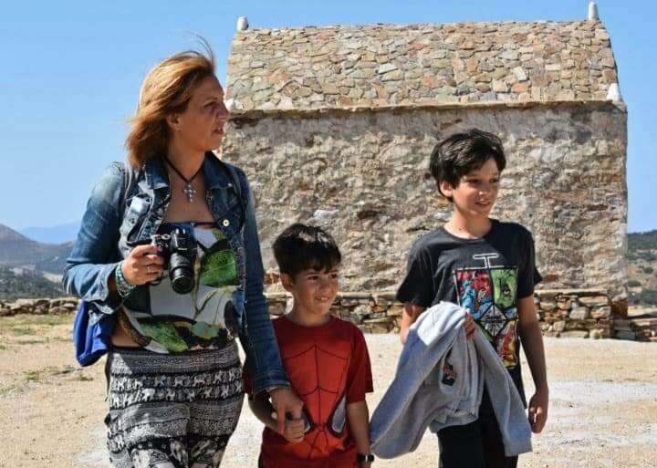 Kids and mom traveling in Greece.