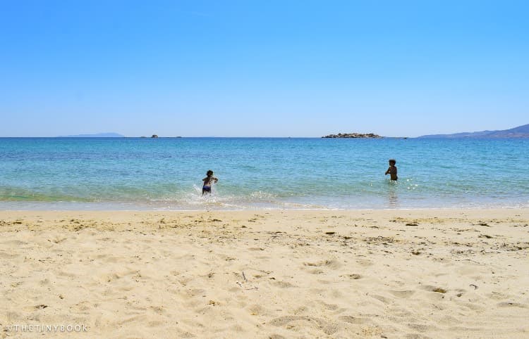 Crete or Naxos: Which Greek Island Should Be Your Next Stop? 13 crete or naxos Kids in the sea Naxos Greece