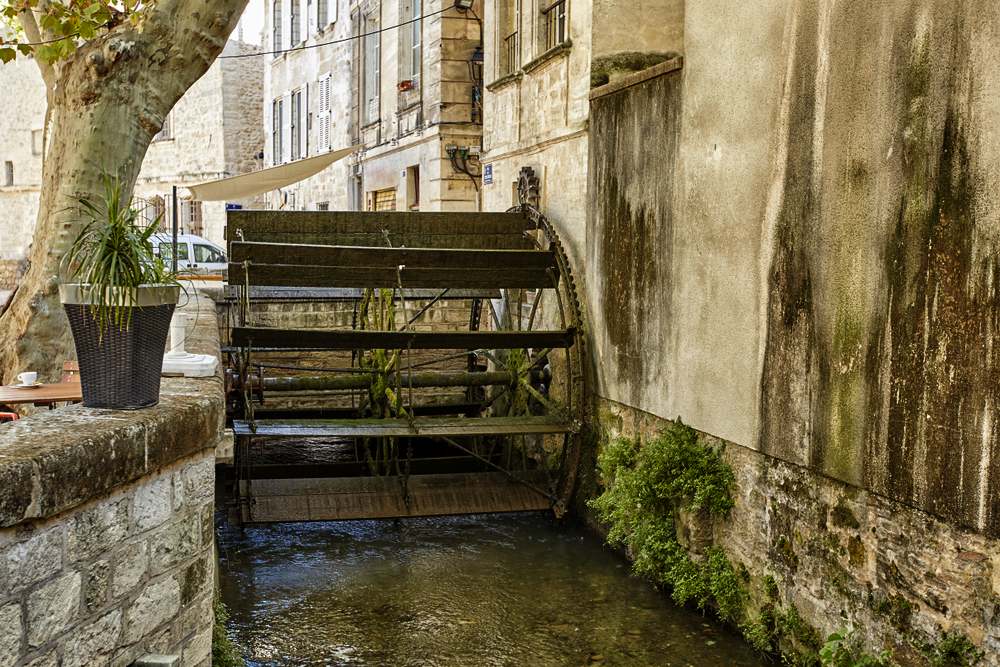 Avignon, France. Terrace with a water Mill in Rue des Teinturiers